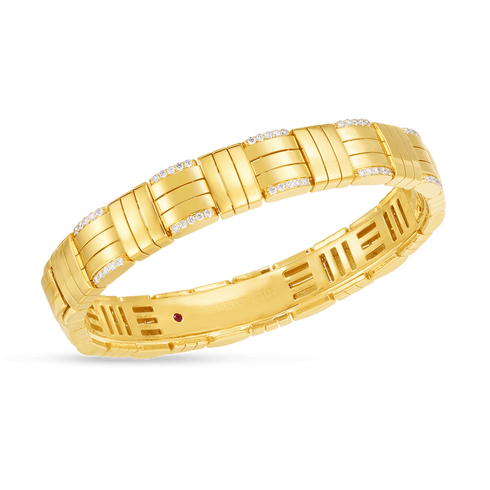 Gold bracelet with diamond accents on a white background